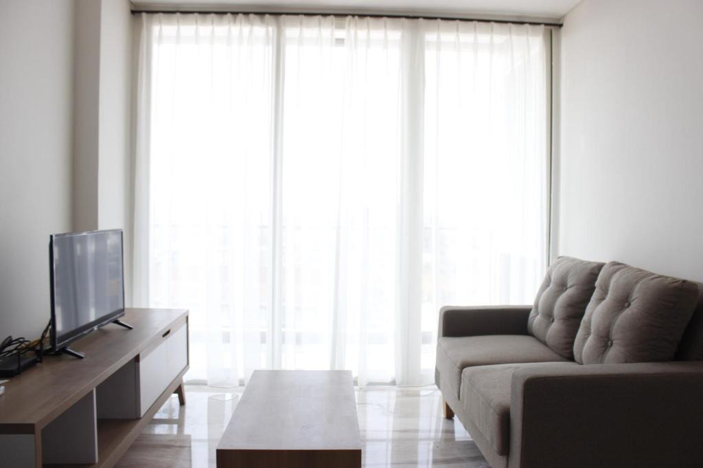 Arjuna Apartment | Artistic 3BR Apartment at Landmark Residence By Travelio