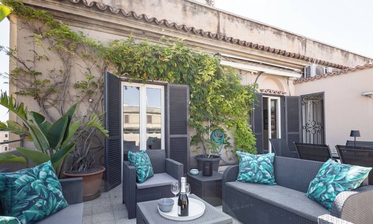 Monti Apartment | Penthouse with large terrace overlooking Colosseum and center of Rome.