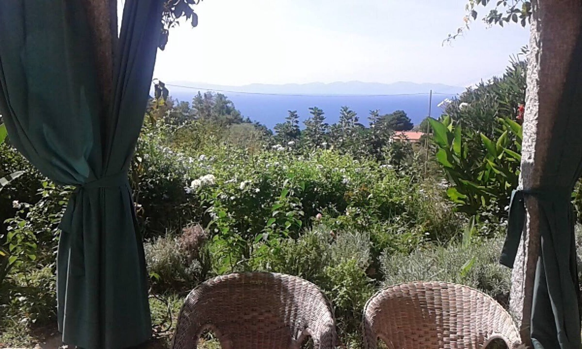 Zanca House | Sunset over Corsica. Detached house surrounded by greenery, sea view.
