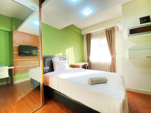 Cileunyi Apartment | Warm Studio Apartment at Harvard Jatinangor By Travelio