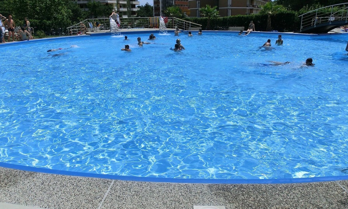 Lignano Sabbiadoro Apartment | Wonderful studio with swimming pool, spacious terrace and sea view by Beahost