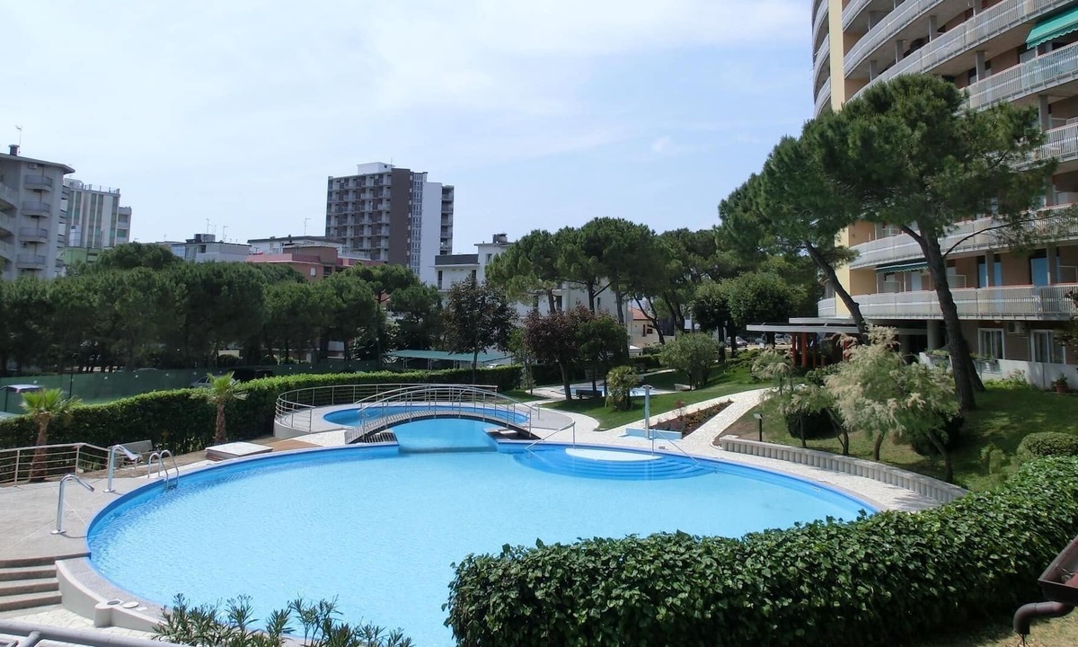 Lignano Sabbiadoro Apartment | Wonderful studio with swimming pool, terrace and sea view by Beahost Rentals