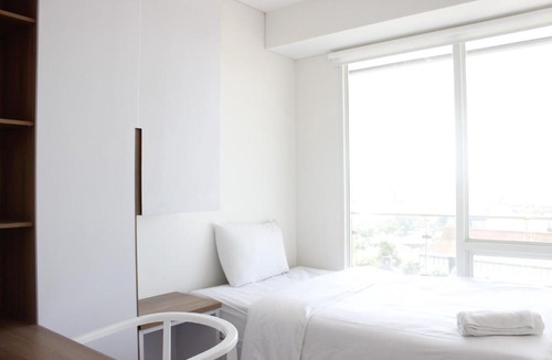 Arjuna Apartment | Artistic 3BR Apartment at Landmark Residence By Travelio