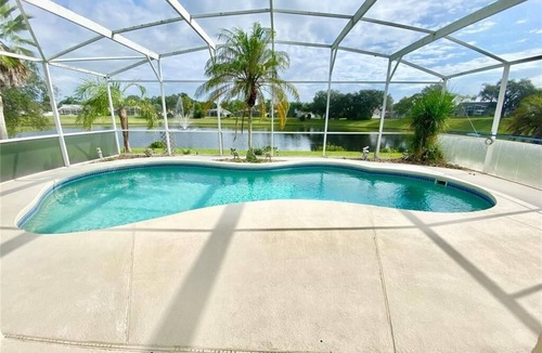 Sunridge Woods House | Beautiful waterfront home with heated pool and game room.