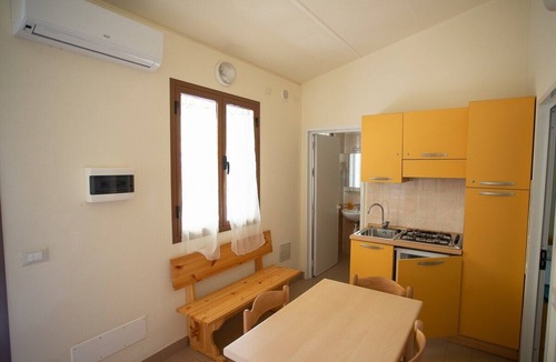 Ex Campo d'Aviazione House | Bungalow in masonry in the campsite