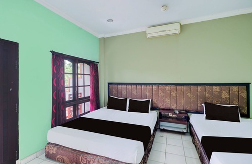 Cokroaminto Hotel | Collection O Bali near Terminal Ubung formerly Batukaru Garden Hotel