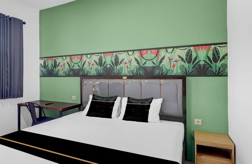 Sunset Road Hotel | Hotel O near Trans Studio Theme Park formerly Sunset Cozy