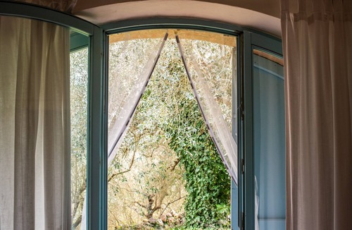 Siena Apartment | ‘Nido Blu Loft’ Apartment with Shared Pool, Private Garden, and Wi-Fi