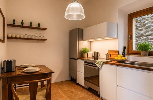Scrofiano Apartment | Panoramic Views in the Heart of Tuscany, Historic Borgo Apartment with balcony.