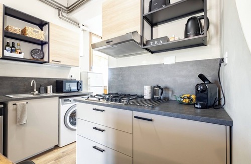 Monti Apartment | Penthouse with large terrace overlooking Colosseum and center of Rome.