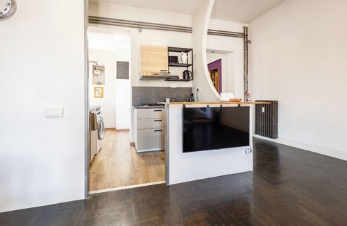 Monti Apartment | Penthouse with large terrace overlooking Colosseum and center of Rome.