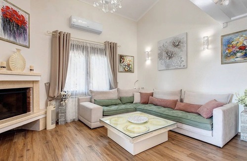 Pyrgos Villa | R 3281 Villa Harmony With Fireplace ,Dining Table & Bottle of Wine.