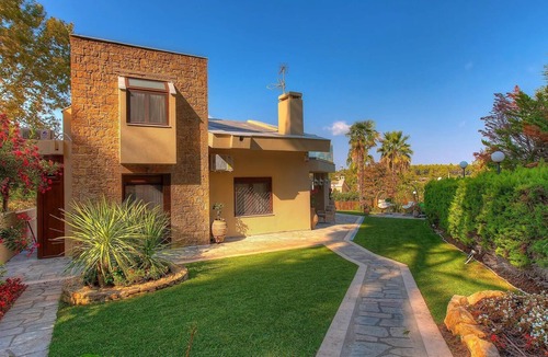Pyrgos Villa | R 3281 Villa Harmony With Fireplace ,Dining Table & Bottle of Wine.