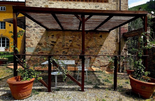 Sant'Andrea di Compito House | Restored barn with large pool and mountain stream