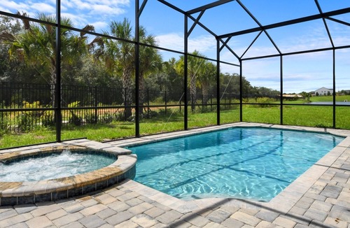 Bay Lake Villa | Striking 9BR Pond view Pool/SPA near Disney World