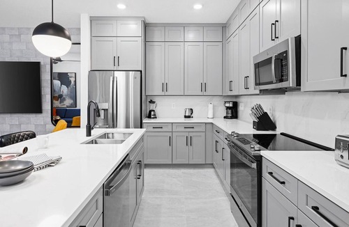 Florida Center House | Violet's Vista | Luxe home next to Universal w/spa pool, grand LR/DR, themed BR