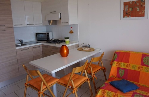 Lignano Sabbiadoro Apartment | Wonderful studio with swimming pool, spacious terrace and sea view by Beahost