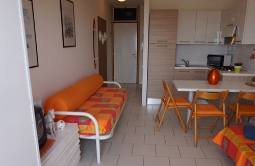 Lignano Sabbiadoro Apartment | Wonderful studio with swimming pool, spacious terrace and sea view by Beahost