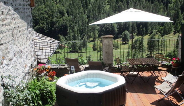 Baite del Baus—Baita d'là Cravià, a renovated old barn with a garden.