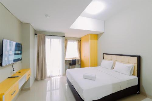 Homey Studio at LRT City Sentul Royal Sentul Park Apartment By Travelio