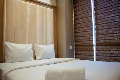 Nice and Homey 2BR Apartment at Capitol Park Residence By Travelio