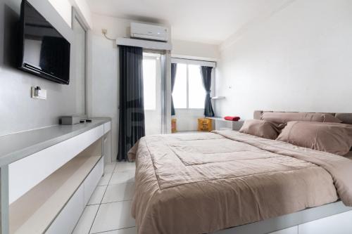 RedLiving Apartemen Riverview Residence - UV Rooms Tower Mahakam with Netflix