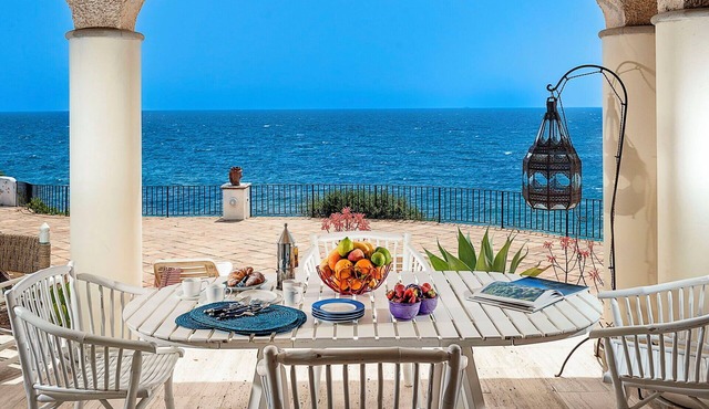 Waterfront villa with panoramic terrace and garden