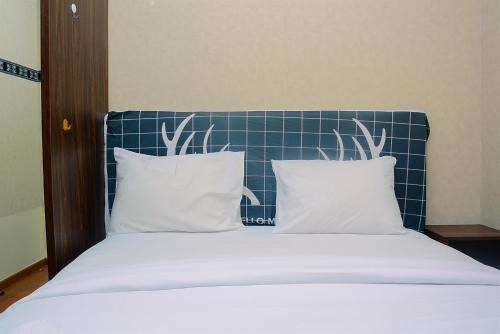 Beautiful 2BR with Direct Access to Pool Green Bay Pluit Apartment By Travelio