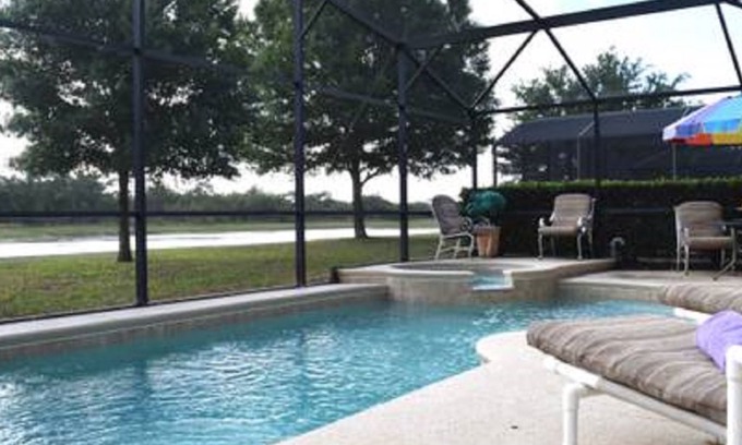 Sunrise Lakes Villa | Charming water view villa with swimming pool, spa and next to the Disney Parks