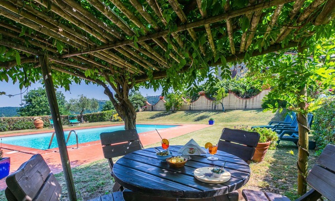 Castelnuovo di Val di Cecina Apartment | Lovely apartment for 4 guests with WIFI, A/C, pool, TV, patio and pets allowed