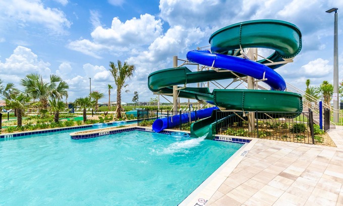Kissimmee Condo | Modern Storey Lake Condo, 5 mi to Disney, Foosball, Giant Water Slide