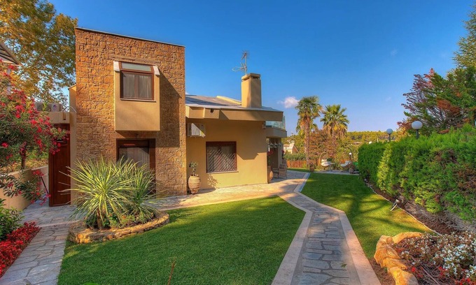 Pyrgos Villa | R 3281 Villa Harmony With Fireplace ,Dining Table & Bottle of Wine.